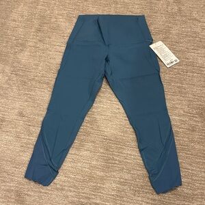 NWT Lululemon wonder under high-rise crop 23” inseam. Size 8, smoky blue.